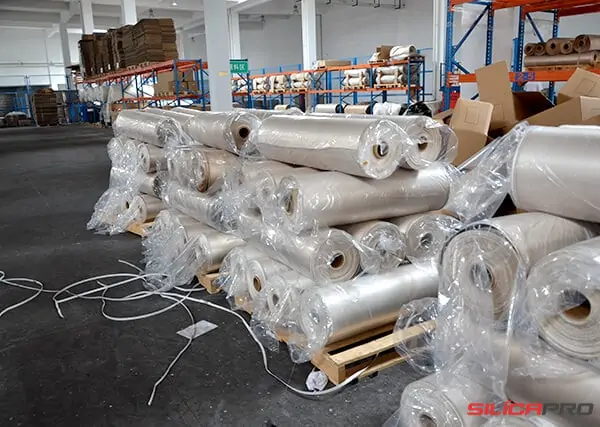 Uncoated high silica fabric rolls wrapped in plastic and stacked ready for shipment