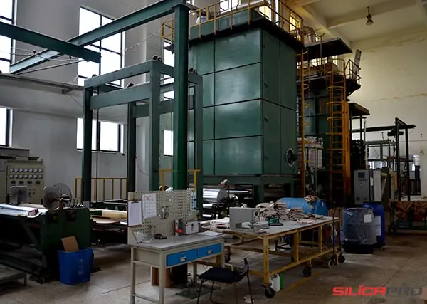 Vertical high temperature heat treatment furnace for high silica fabric