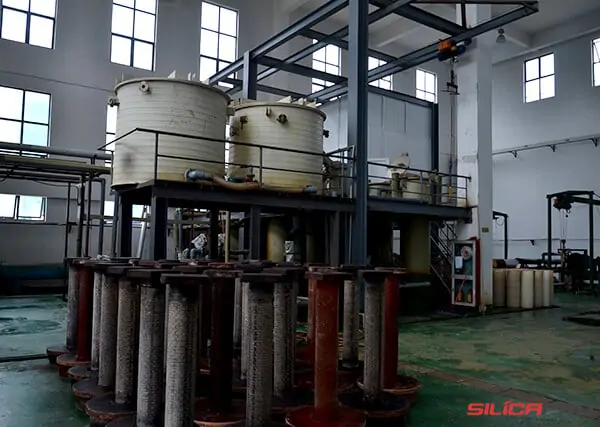 Chemical treatment tanks and yarn bobbins in the silica fibre leaching workshop