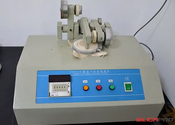 Taber type fabric abrasion tester checking durability of high silica fabric
